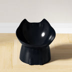 Black cat-ear raised tilted cat bowl on a wooden floor — black | Pawnests